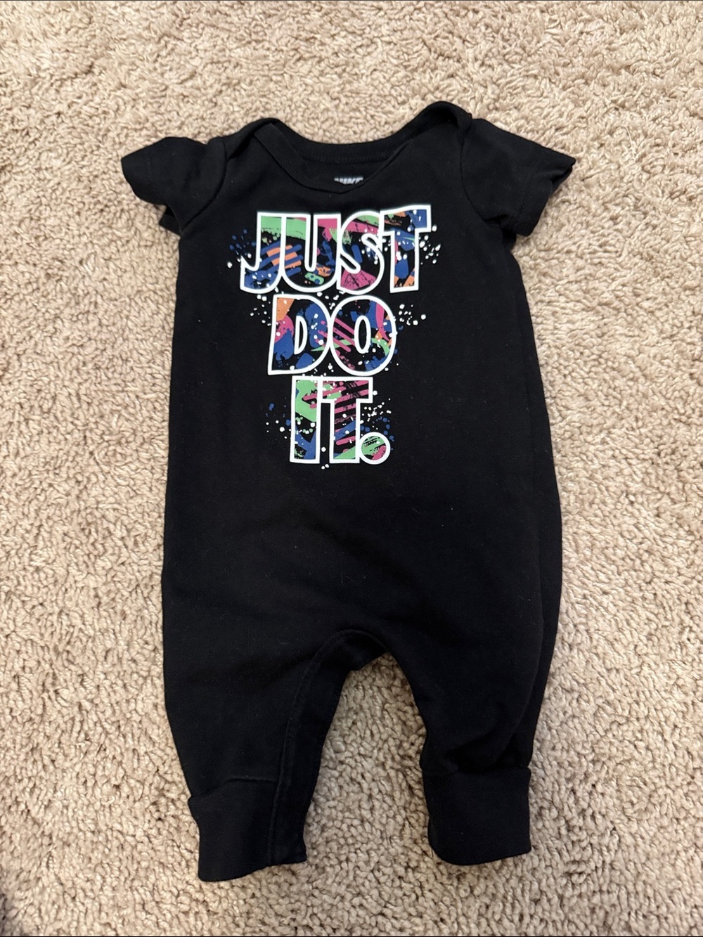 Nike Black Baby One-Piece Footie with Colorful "Just Do It" Graphic size newborn